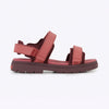 Red sandal with a thick sole on a light gray background