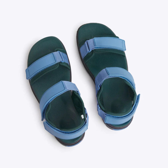 Blue and green sandals on a white background
