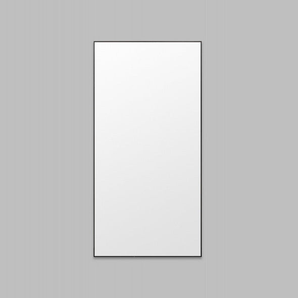 Rectangular mirror with black frame on a gray background