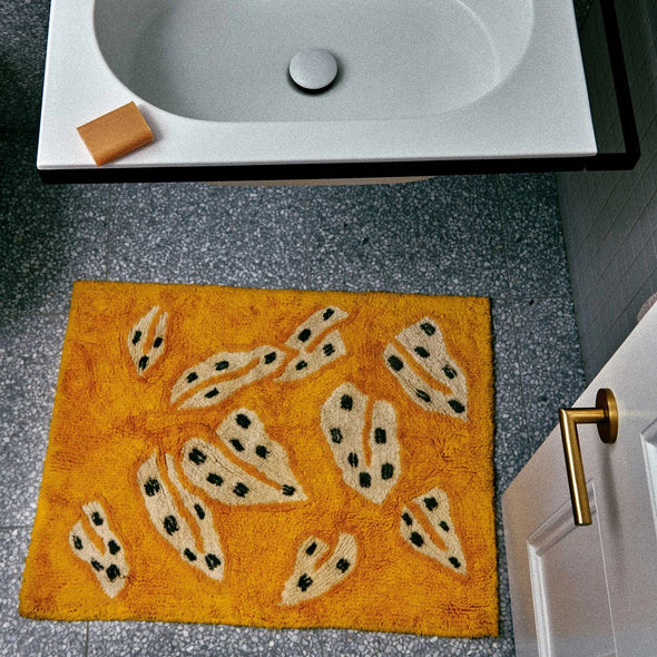 Spotted Begonia Mustard Bath Mat by Bonnie & Neil
