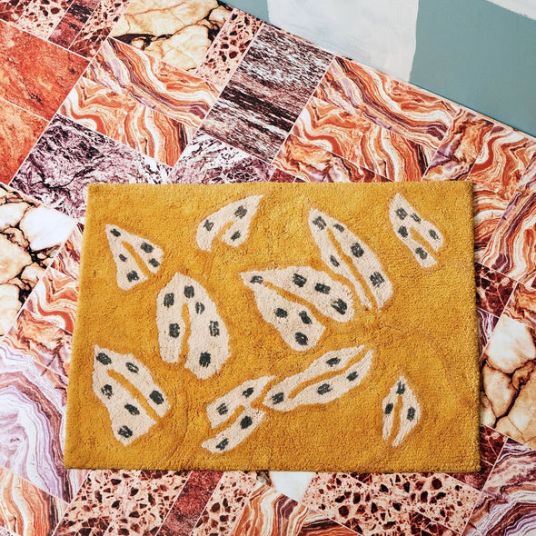 Spotted Begonia Mustard Bath Mat by Bonnie & Neil
